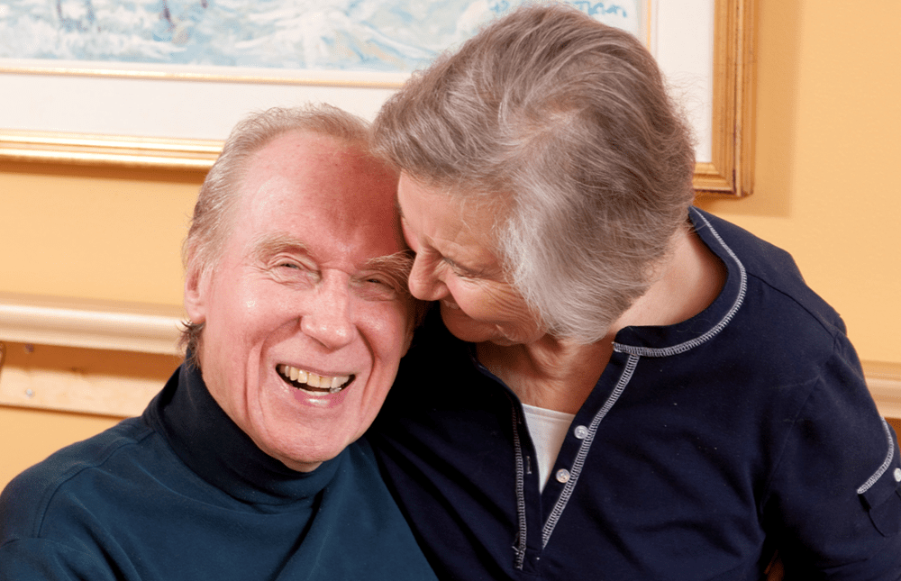 Husband and wife share a laugh together