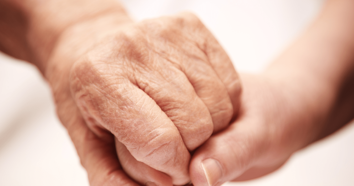 Senior holding daughter's hand