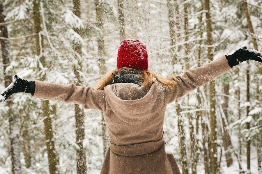 Women enjoys freshly fallen snow