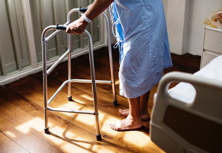 Senior using a walker in the hospital