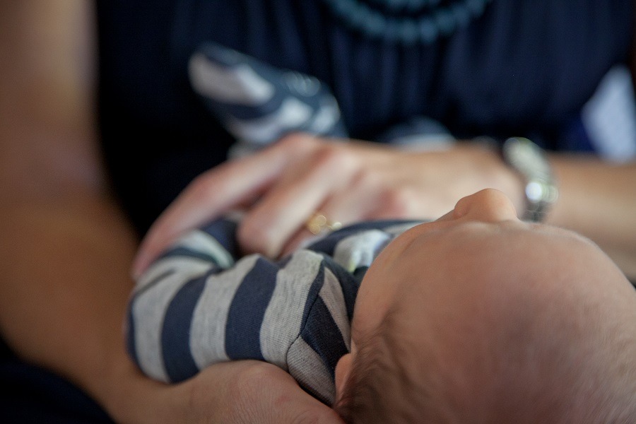 Women holds new born baby