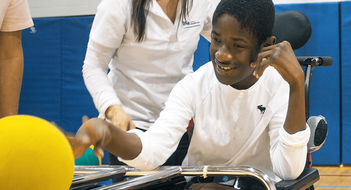 A child with complex medical needs plays during a Playdate session