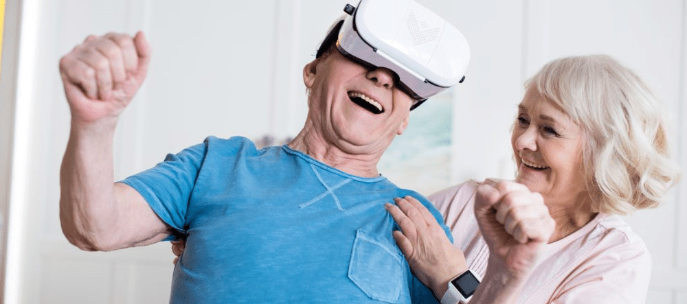 Elderly man plays on Virtual Reality headset