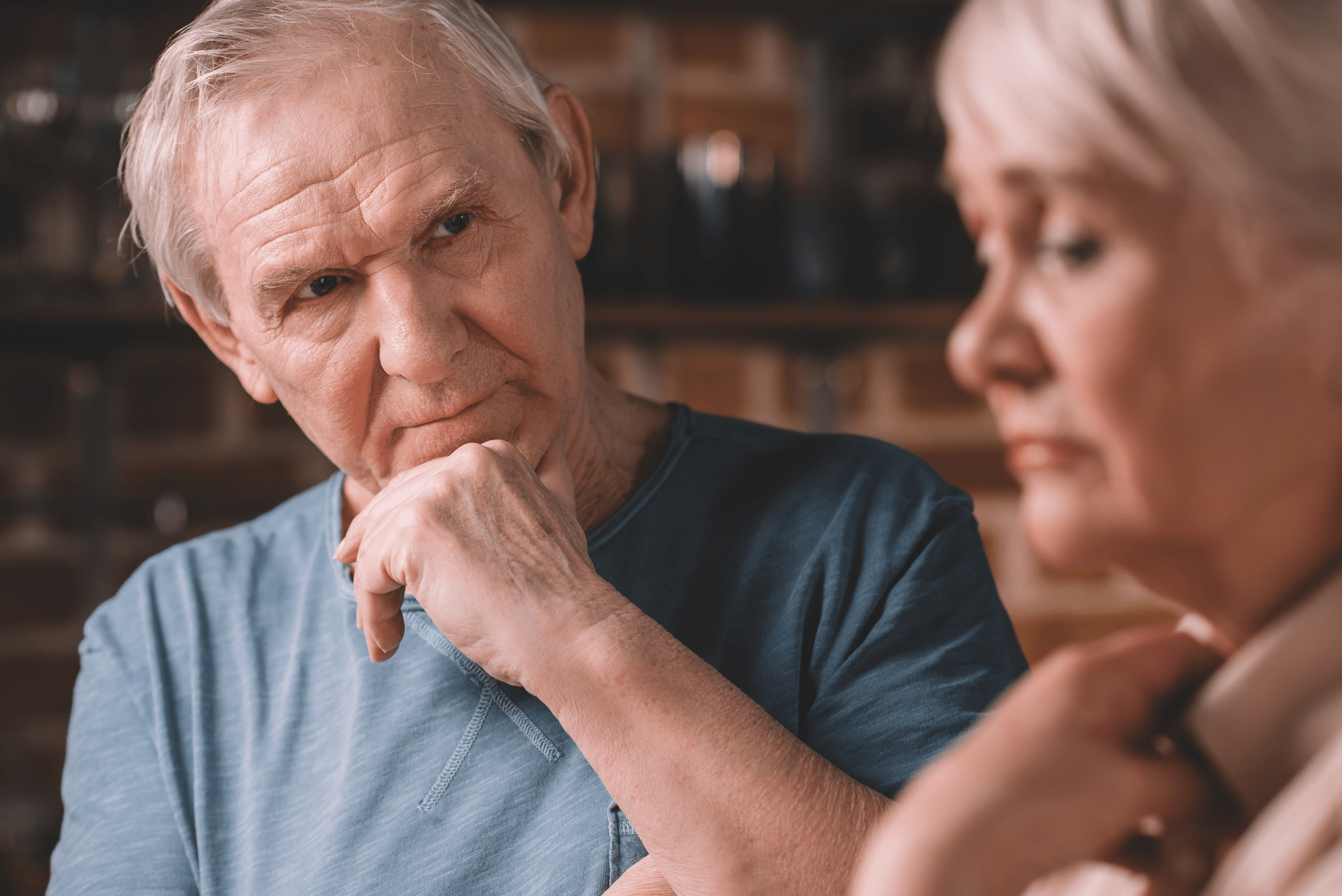 Angry man looking on upset woman