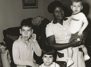 Black and white photo of VHA employee with three children