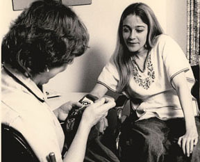 Sepia photo of a nurse and her client