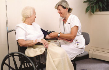 Nurse and her wheelchair bound client