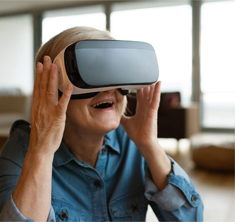 Elderly woman smiling with a virtual reality device