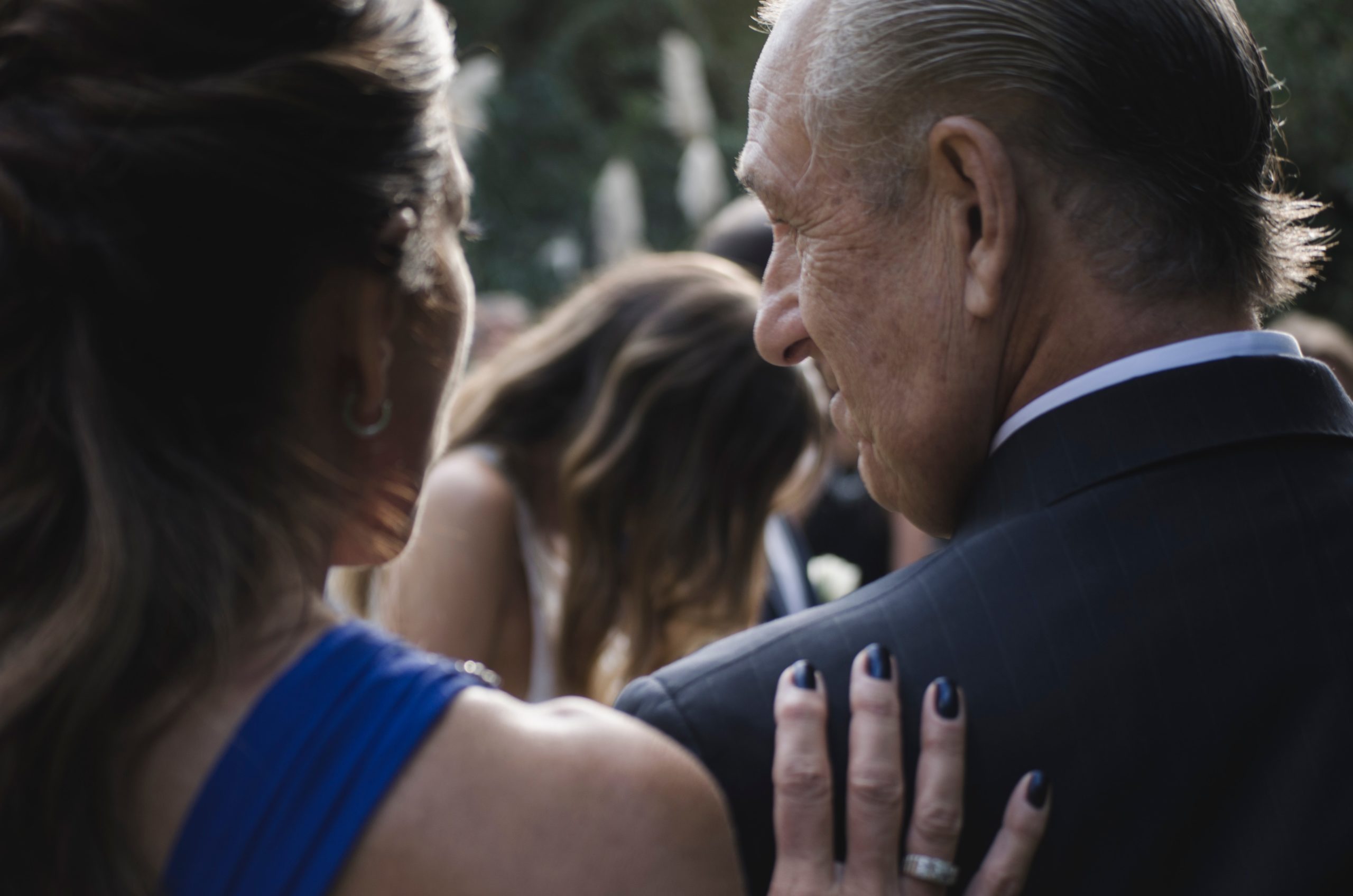 Women patting the back of their loved one