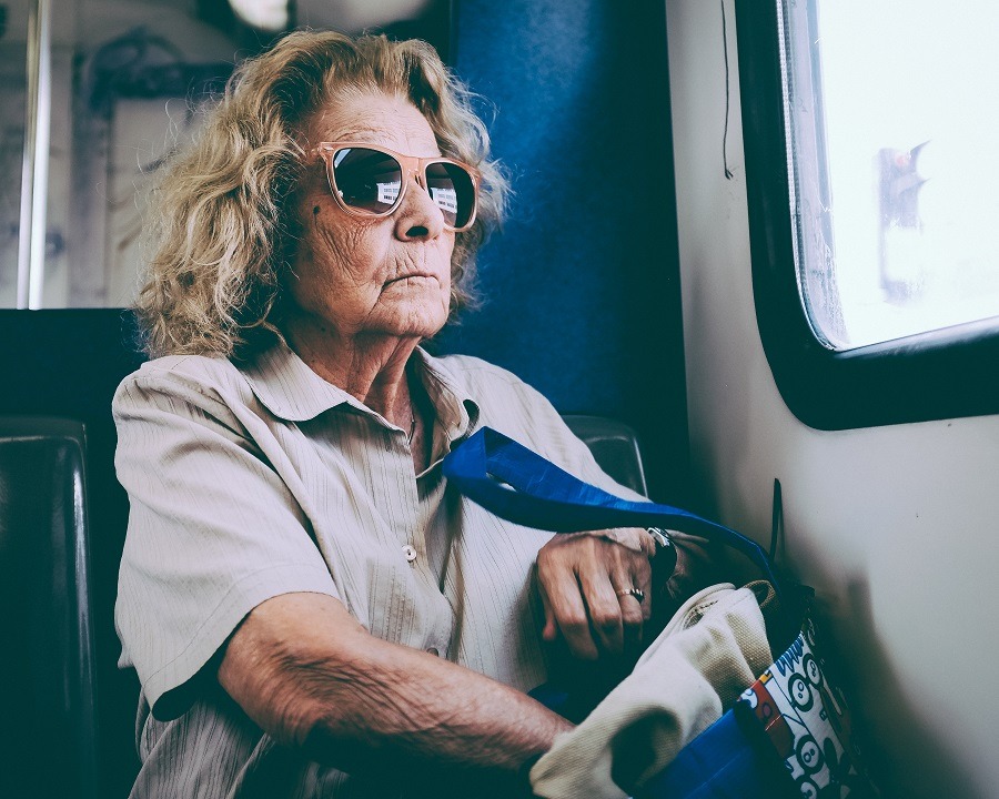 Women with sunglasses travels on bus