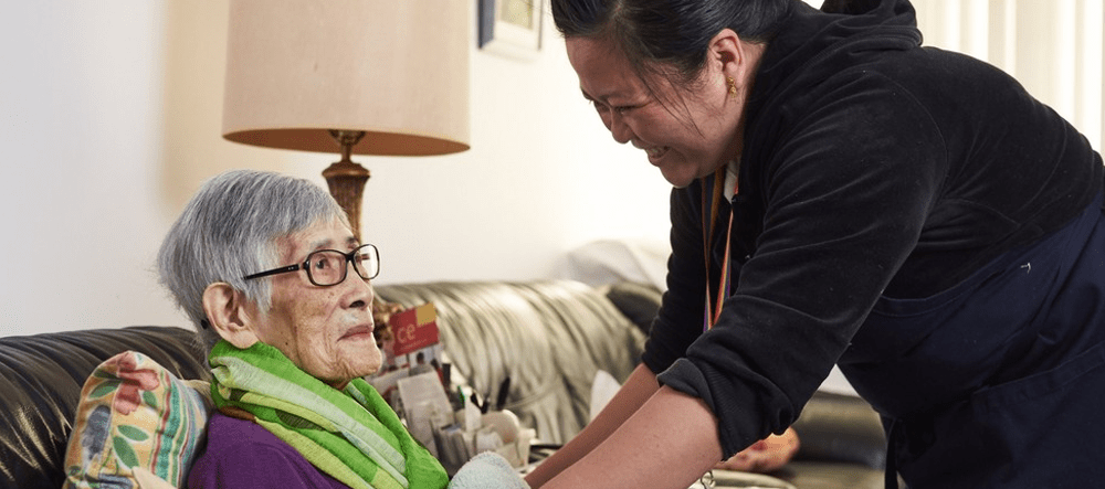 Personal Support Worker helping client