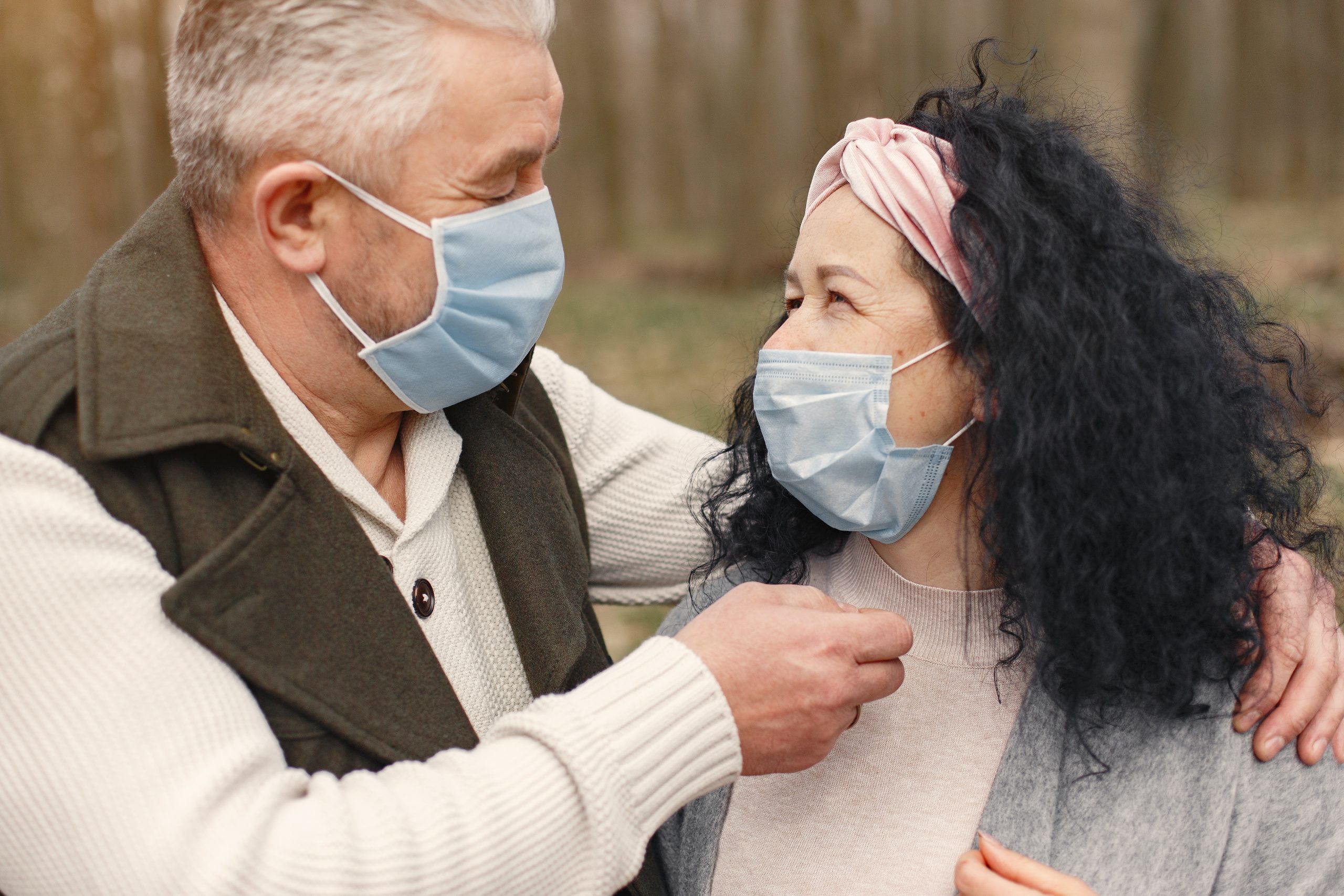 Elderly couple wearing masks