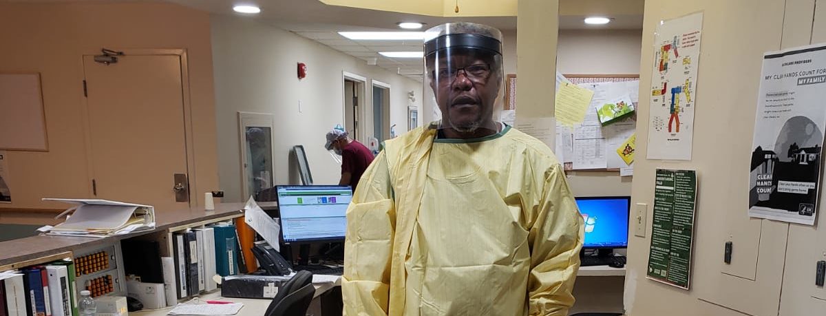 Akil wearing personal protective equipment