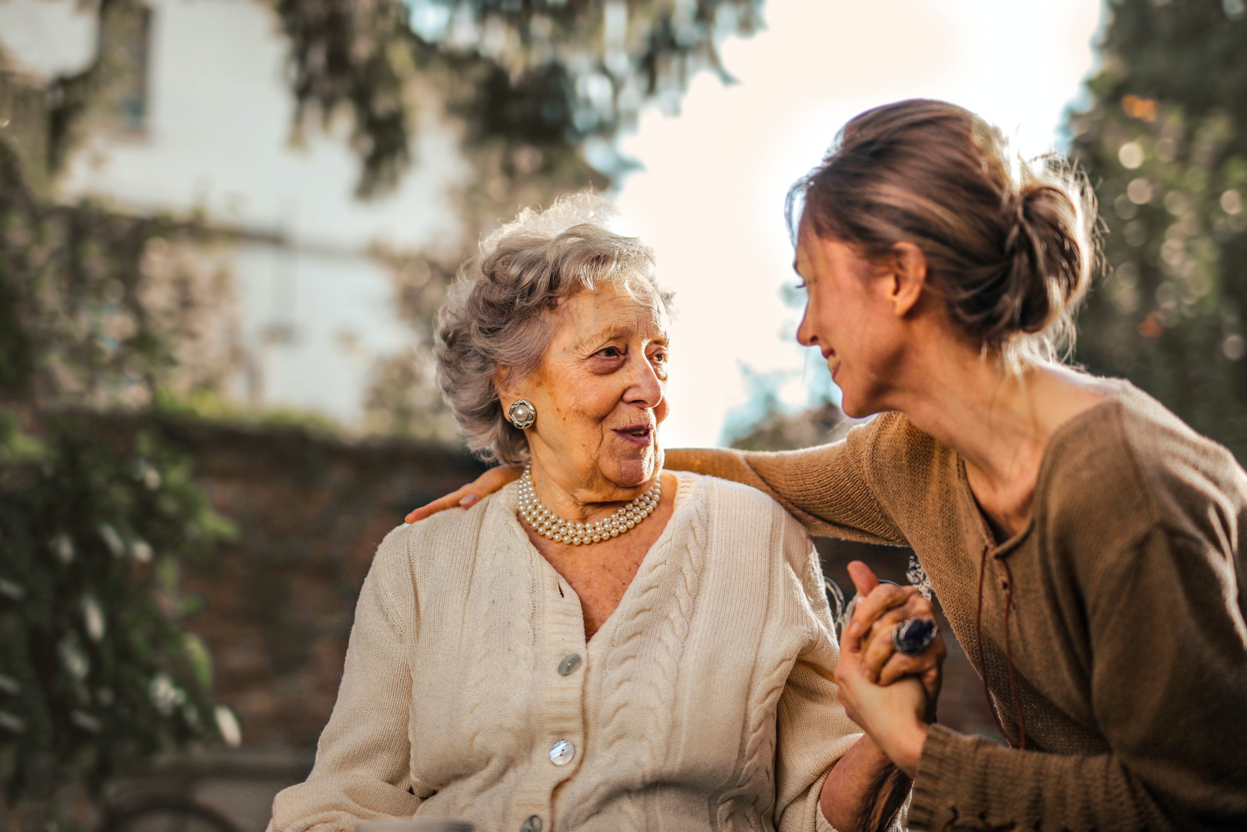 A woman greeting her senior mother