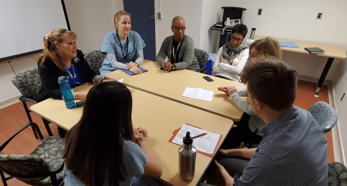 Members of Sunnybrook's team meet every day to discuss the cases of emergency room patients who may need extra supports to make the transition home, rather than be admitted to hospital. (Paul Smith/CBC)