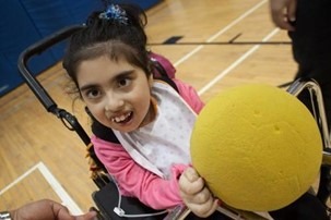 Child holding a ball