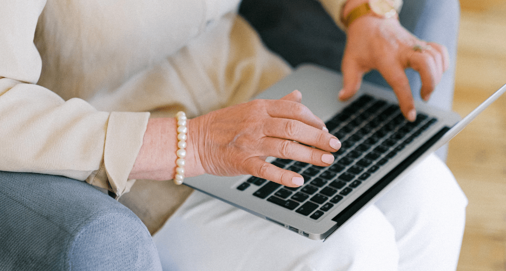 Woman completing her Advance Care Directive on laptop