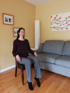 Woman in a chair with her legs raised slightly