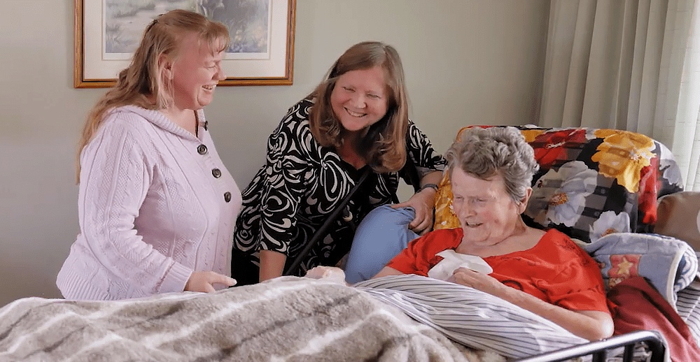 2021 Heart of Home Care winner, Loretta, shares a laugh with her mom Doreen and friend Hayley