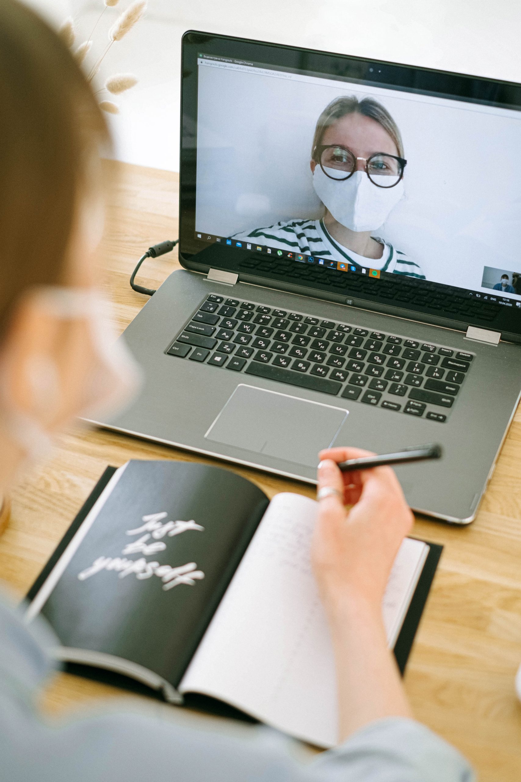 person sitting in front of video call