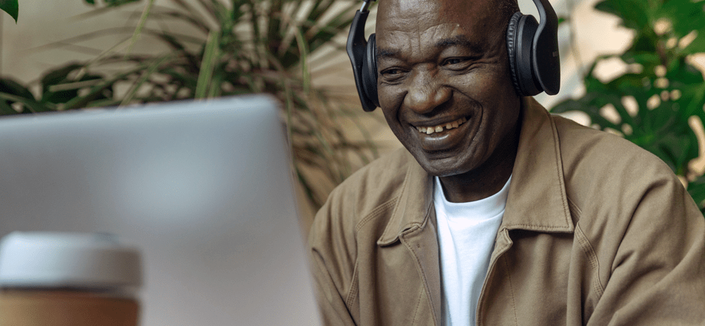 Photo of an old man looking at a laptop by Ron Lach, Pexels