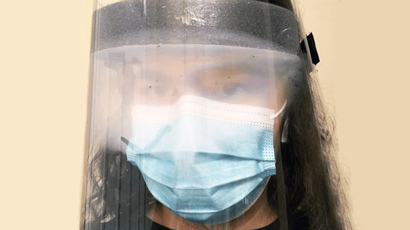 Personal Support Worker with a foggy face shield
