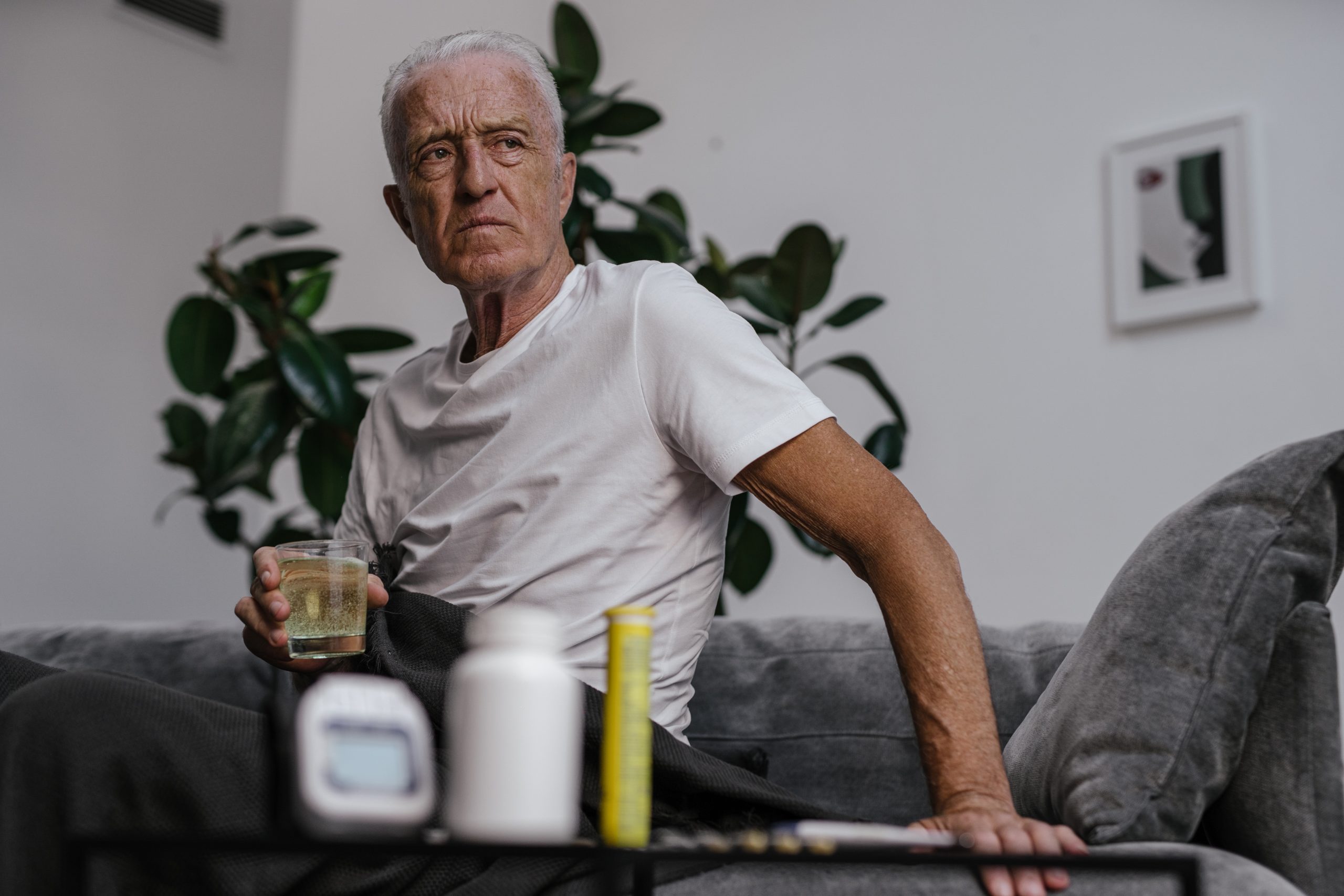 Older man sitting at home