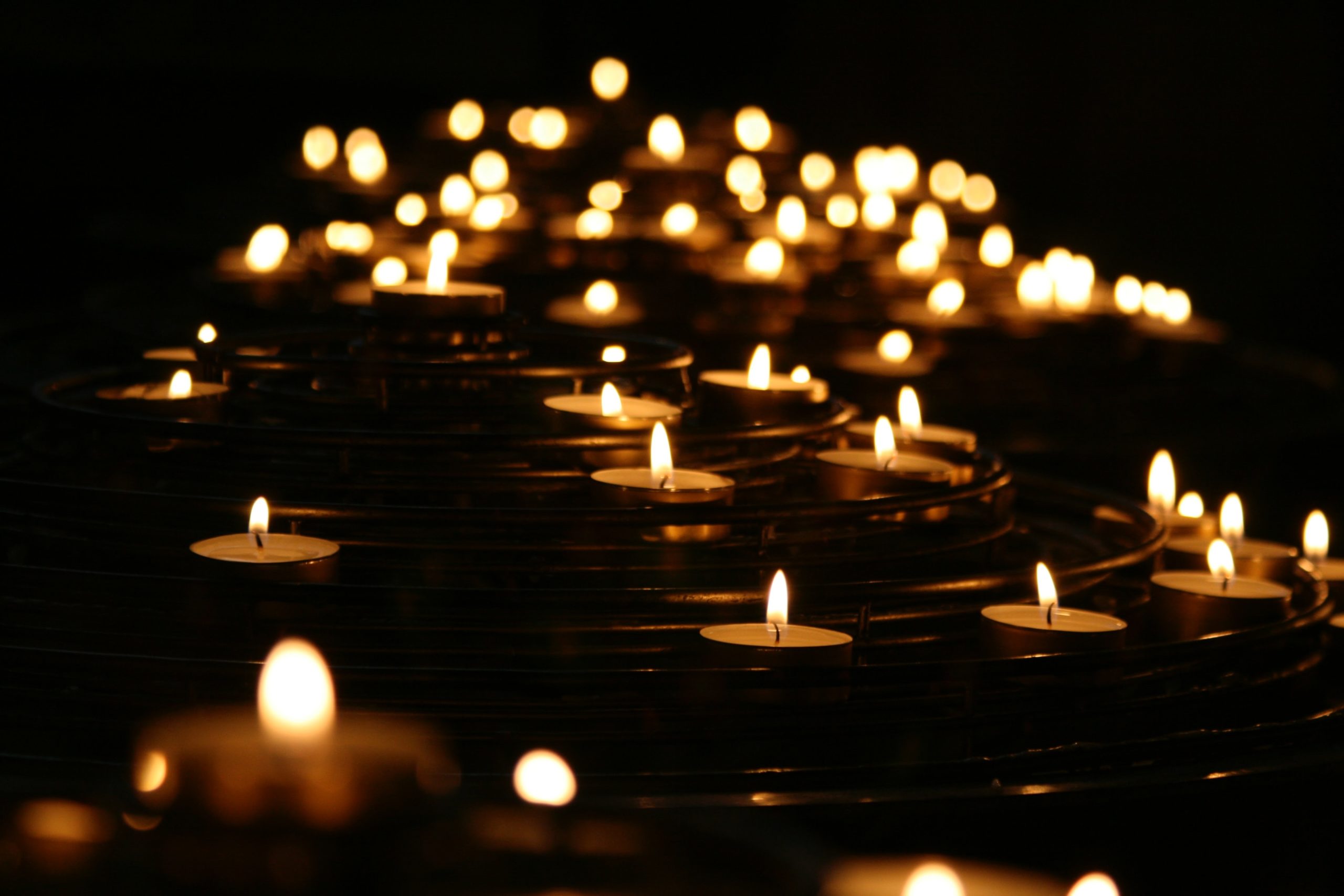 candles gathered in a dark space