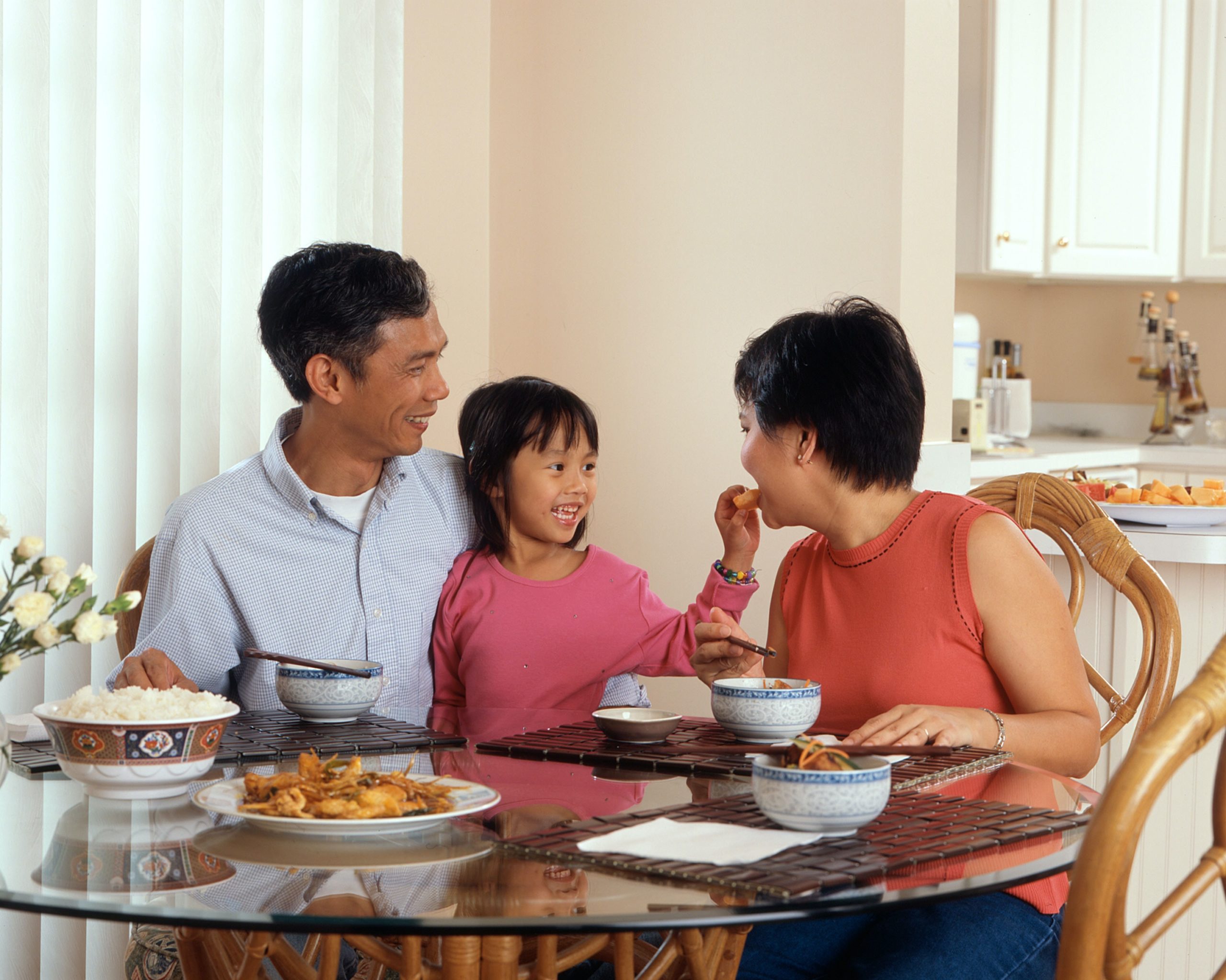 Family eating together at a dinner table