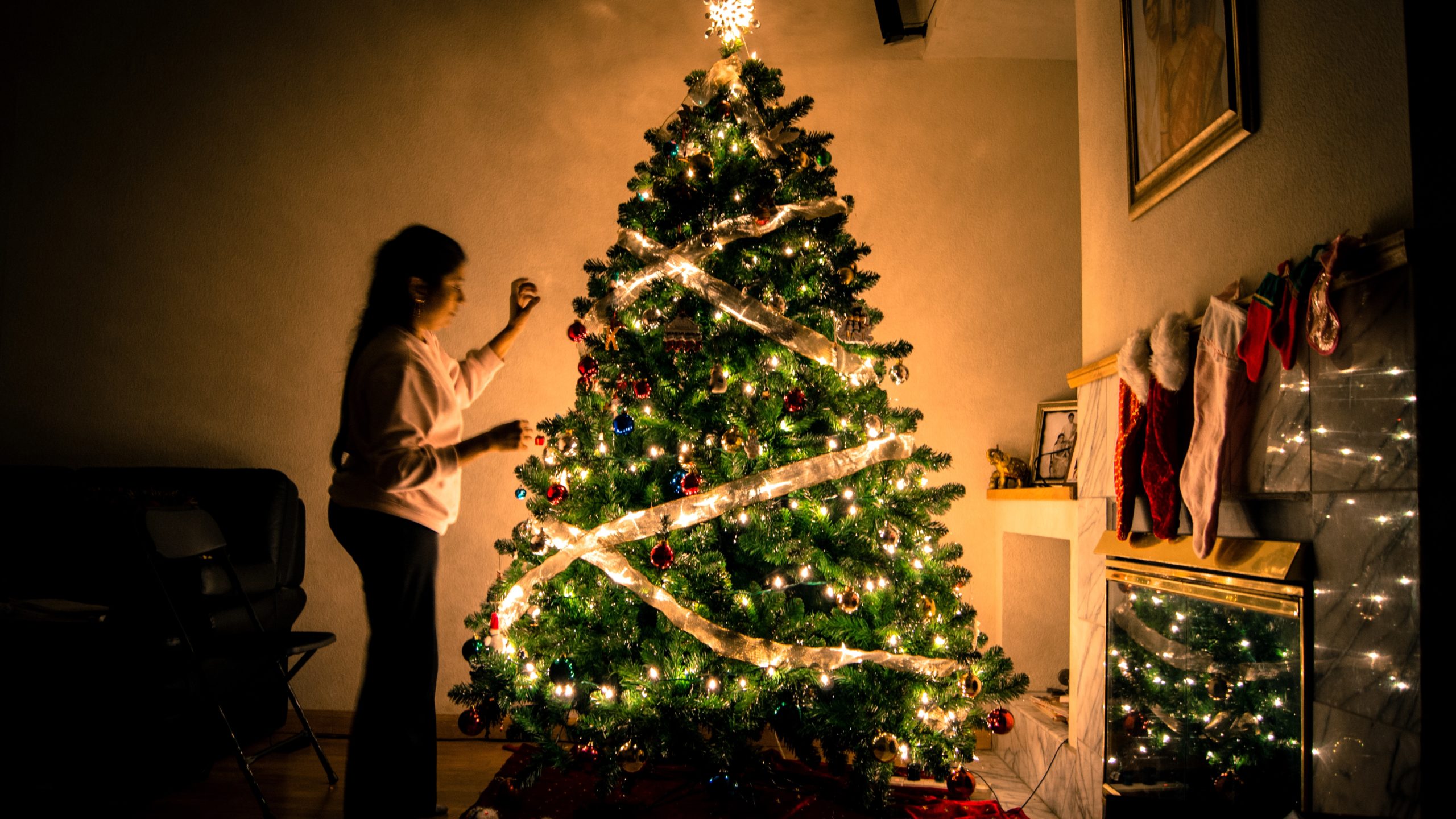 Women hanging decorations for the holidays