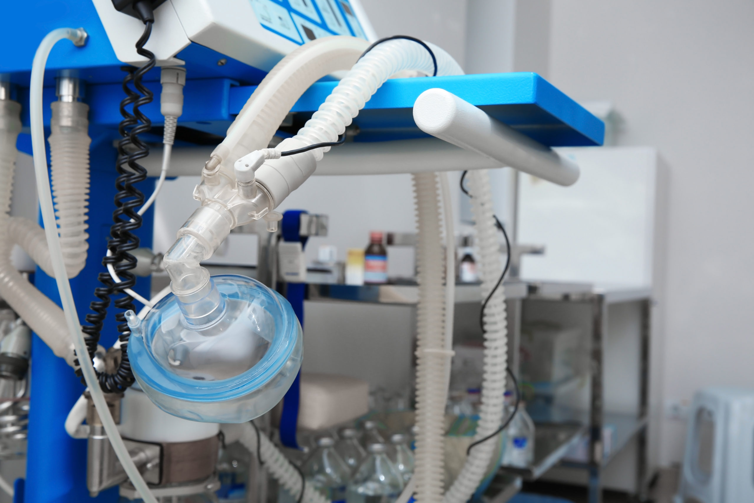 Oxygen mask as part of artificial lungs ventilation machine in surgery room, closeup.