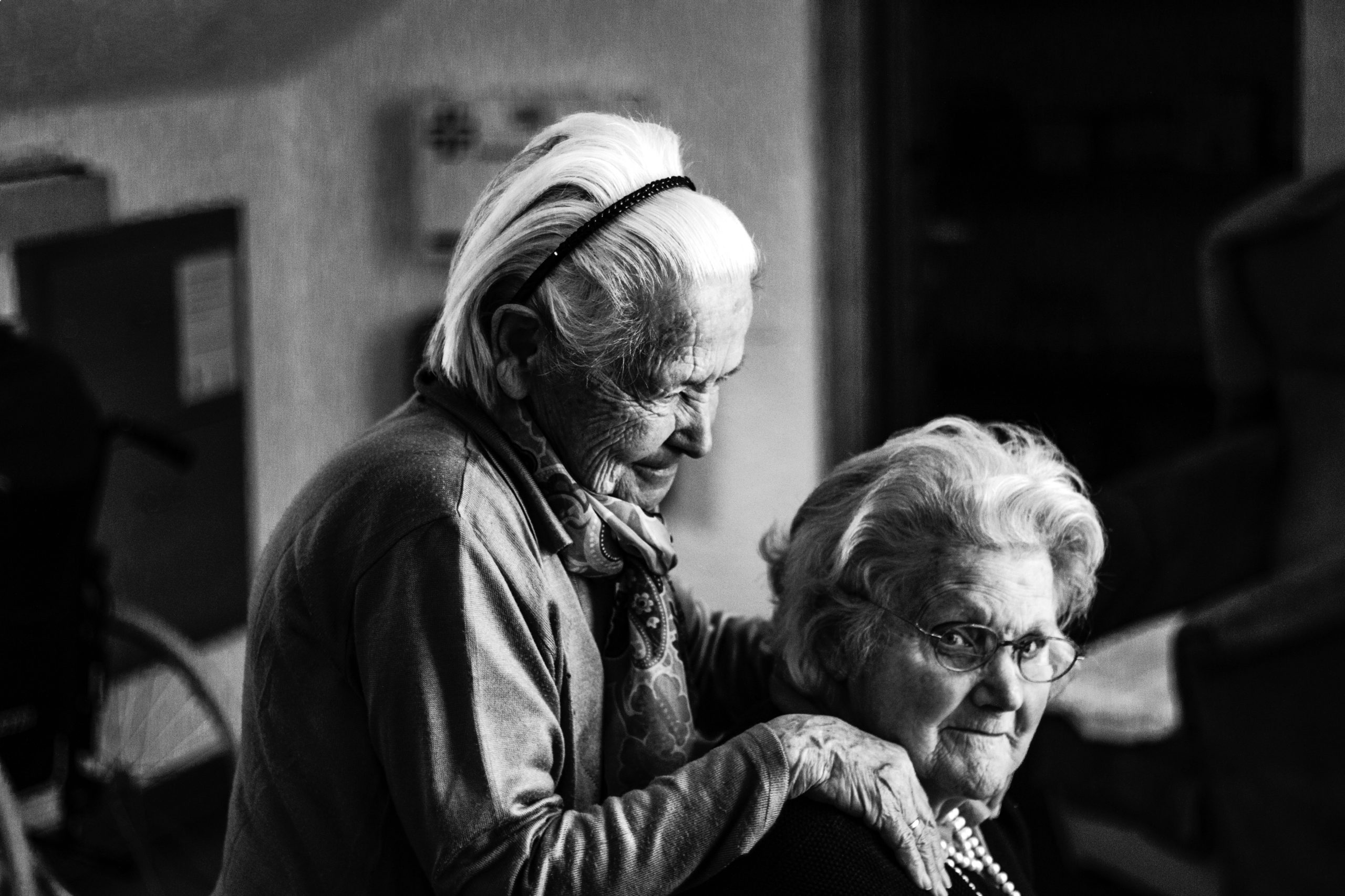 Older woman comforting friend