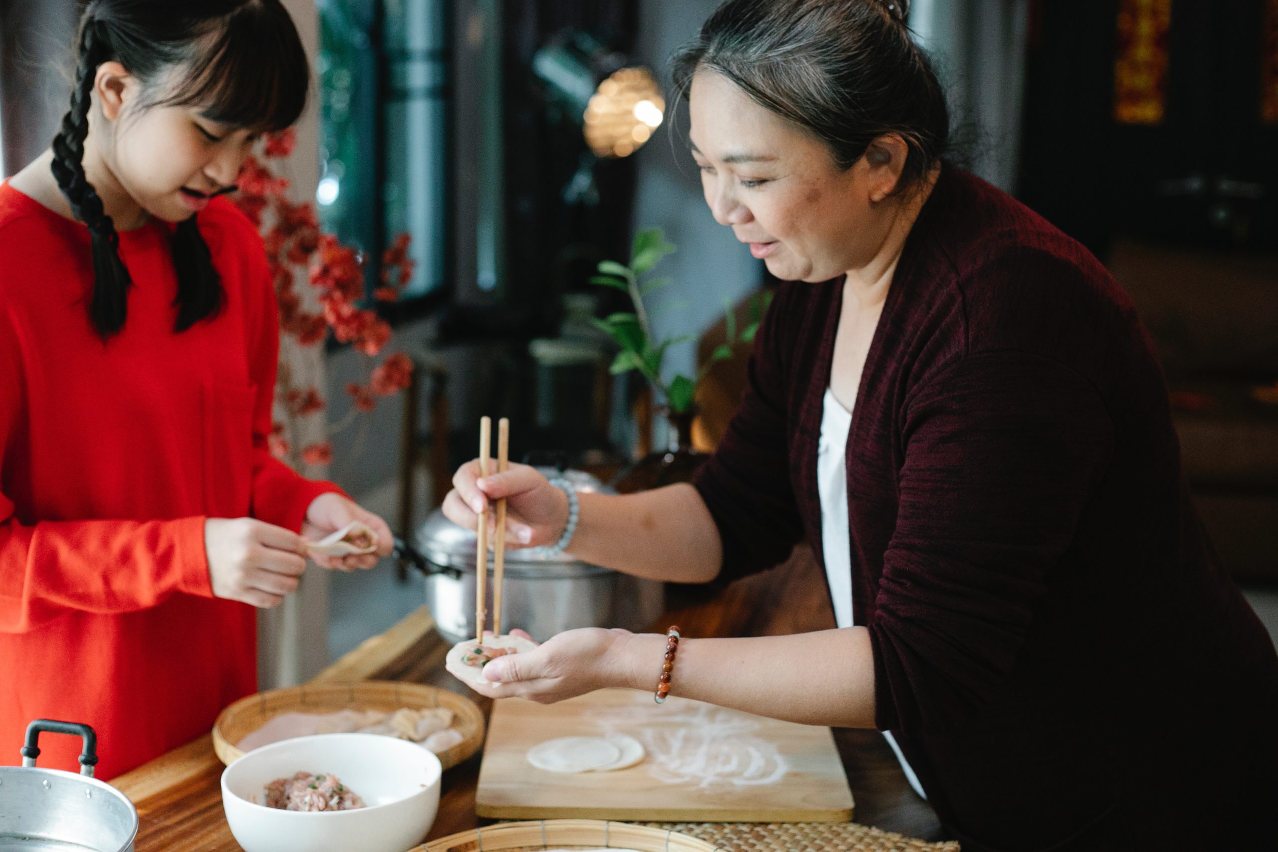 Mom and daughter make dumplings