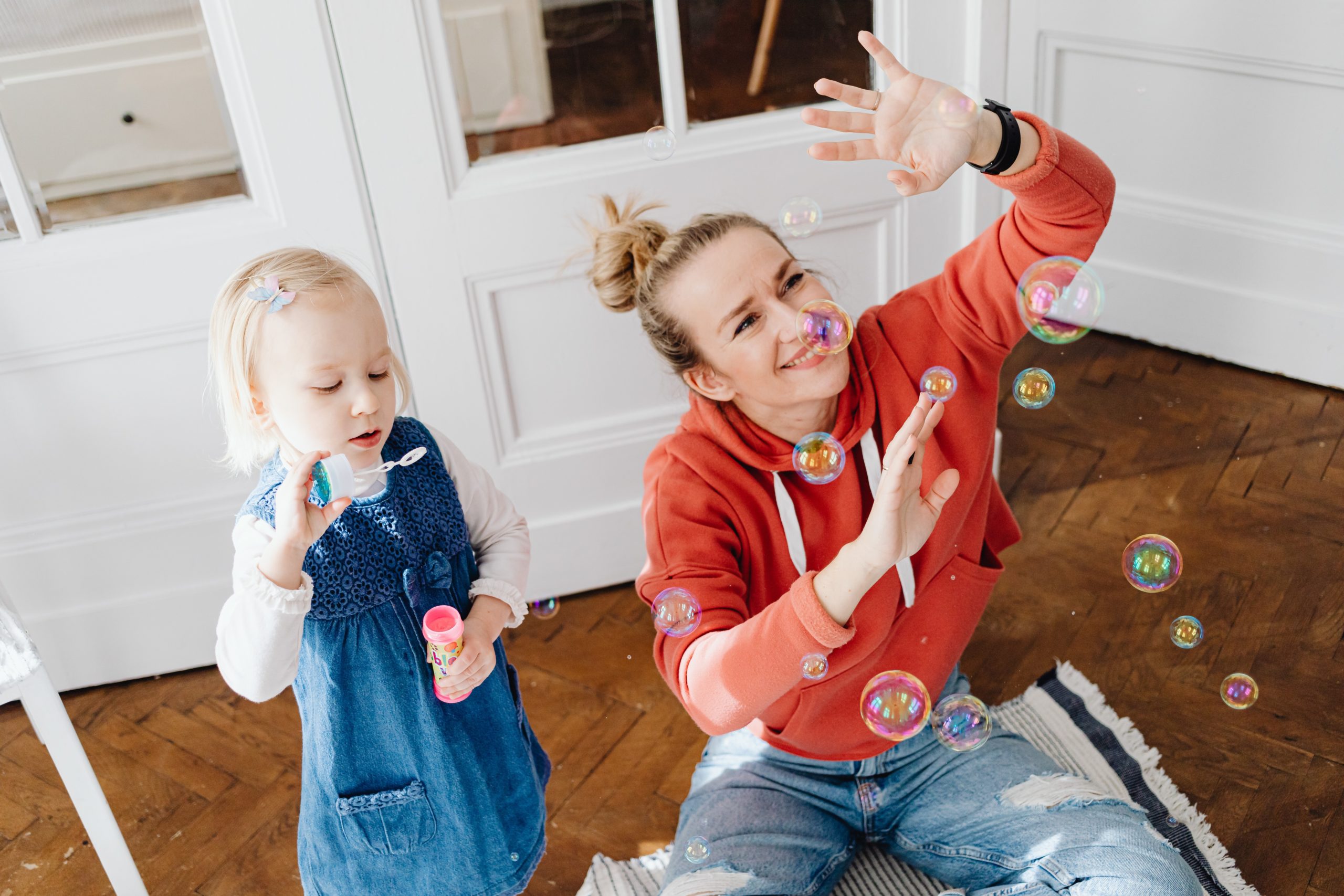 Mother and child blowing bubbles