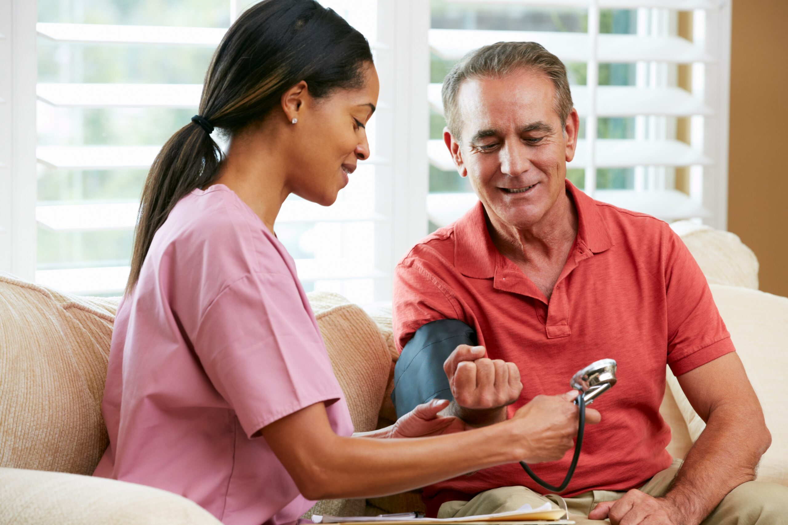 Nurse with senior man in the home