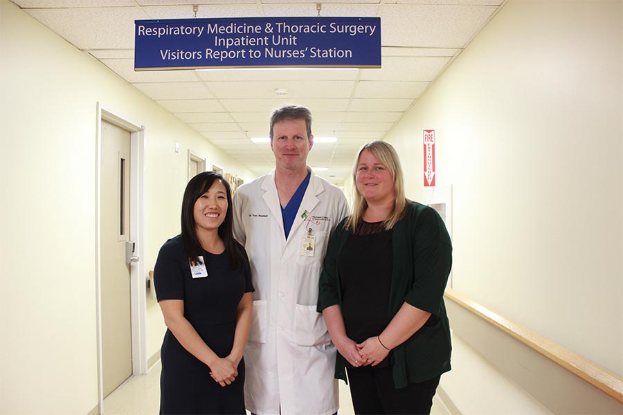 UHN doctor and 2 nurses pose for a photo