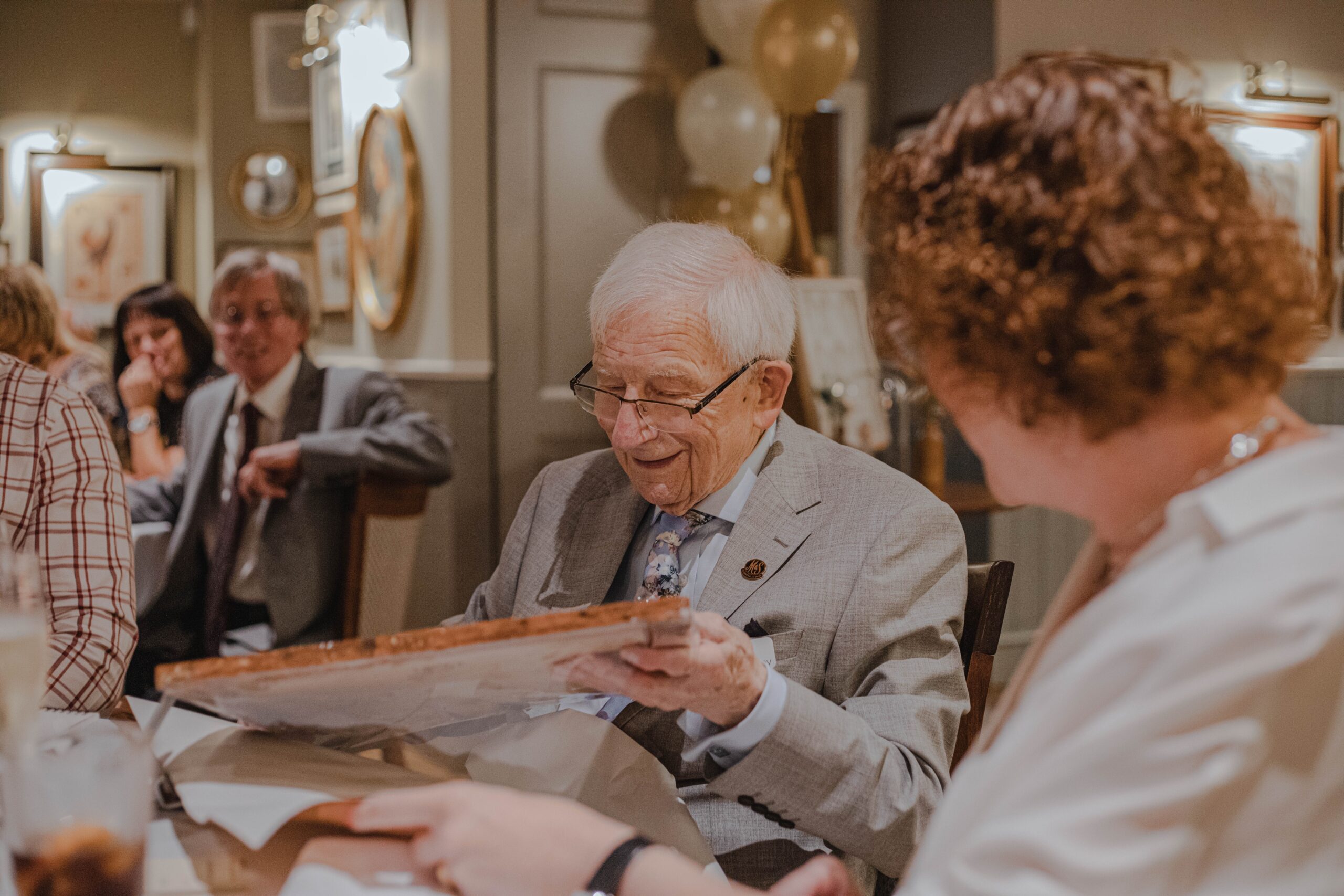 Senior man smiling at restaurant