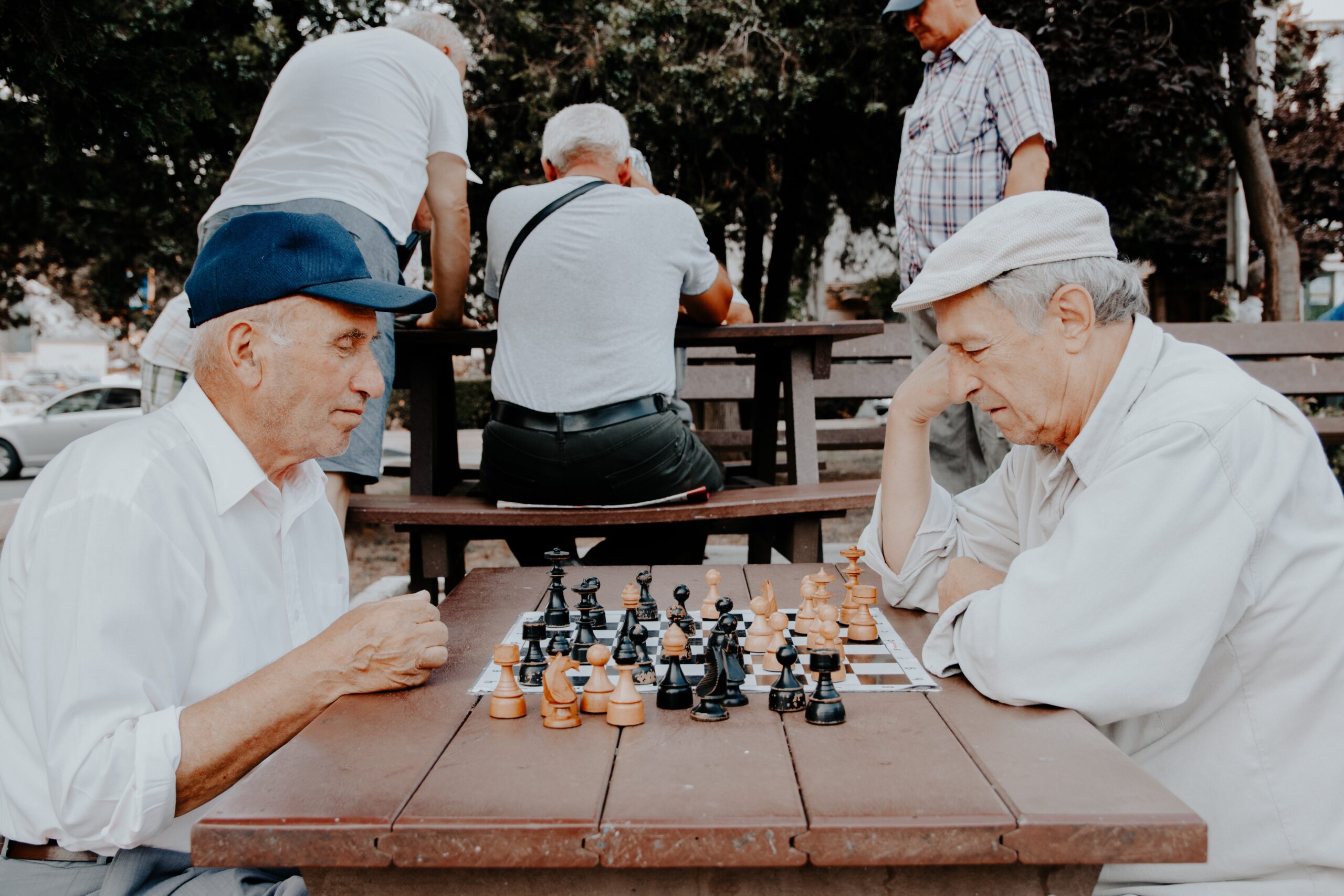 2 older men playing chess