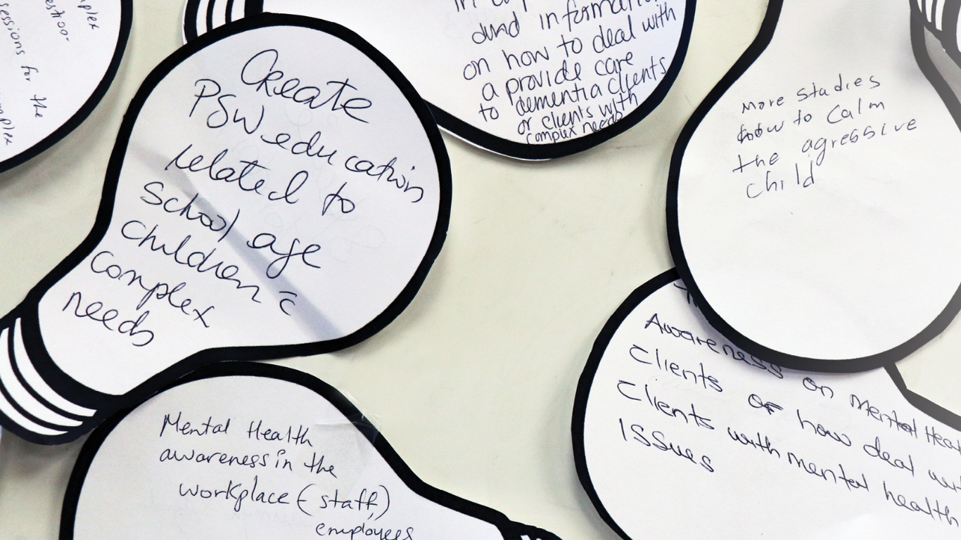 Image of hand-written comment cards in the shape of light bulbs