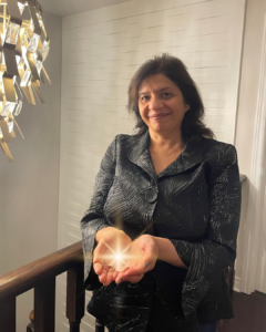 Neetu Kumar holding a spark in her hands