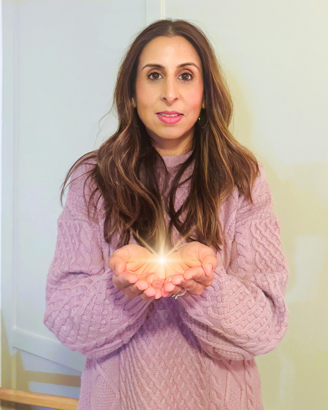 Punita Laurier holding a spark in her hands