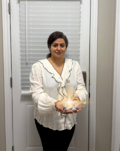 Charishma Monga holding a spark in her hands