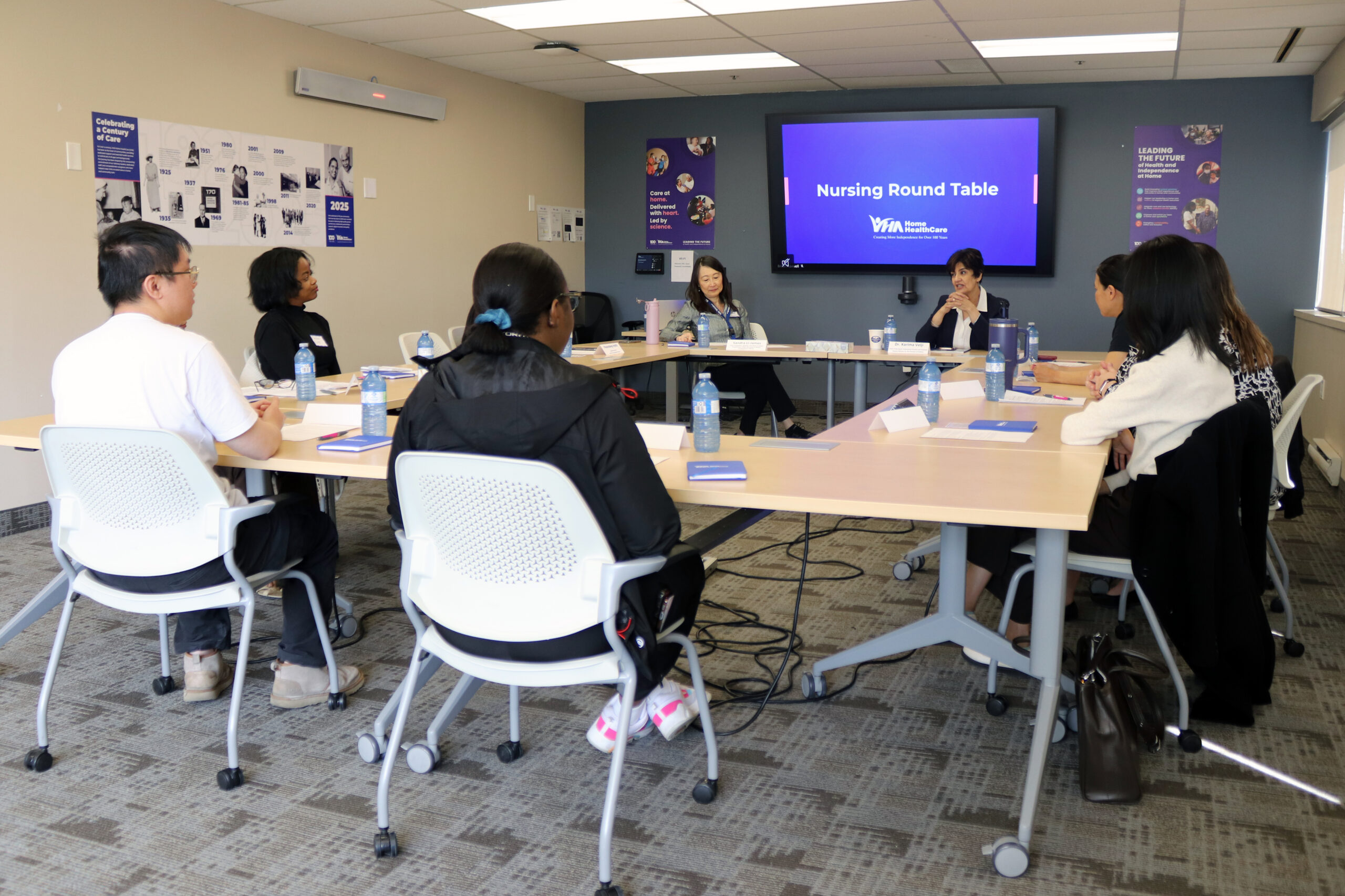 Nursing roundtable with Dr. Karima Velji. A group of nurses sitting around a table