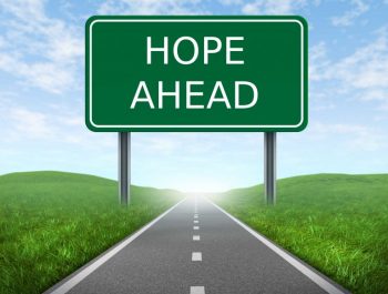 A sign on a road saying 'hope ahead'